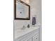 Bright bathroom features a modern sink, vanity and framed mirror at 43 Nordan St, Angier, NC 27501