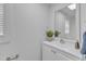 A bathroom with a white vanity, mirror, and decor at 43 Nordan St, Angier, NC 27501