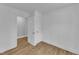 Bedroom featuring wood-look floors, fresh paint, and two closets at 43 Nordan St, Angier, NC 27501