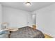 This bedroom features a bed with a patterned cover and a lamp at 43 Nordan St, Angier, NC 27501