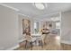Inviting dining area with modern table and chairs, seamlessly flowing into a comfortable living space at 43 Nordan St, Angier, NC 27501