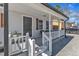 Inviting covered front porch features white railings, seating, and house number 43 at 43 Nordan St, Angier, NC 27501