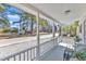 Relaxing front porch view features chairs, greenery, and a neighborhood street at 43 Nordan St, Angier, NC 27501