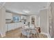 Bright kitchen with white cabinets, appliances, and an adjacent dining area at 43 Nordan St, Angier, NC 27501