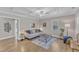 Bright living room featuring decorative ceiling, light wood flooring, and comfortable furniture at 43 Nordan St, Angier, NC 27501