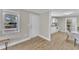 Open-concept living room featuring a dining area, white walls, and light wood flooring at 43 Nordan St, Angier, NC 27501