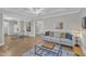Spacious open-concept living area, featuring a sofa, chessboard, and dining area at 43 Nordan St, Angier, NC 27501