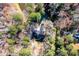 Aerial view of property with a home, surrounded by trees and lush landscaping at 4324 Old Lewis Farm Rd, Raleigh, NC 27604