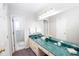 Bathroom features marble countertop, vanity and a large mirror at 4324 Old Lewis Farm Rd, Raleigh, NC 27604