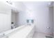Bathroom features double vanity with large mirror, tile flooring and shower/tub combination at 4324 Old Lewis Farm Rd, Raleigh, NC 27604