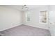 Neutral carpet bedroom with two windows allowing natural light at 4324 Old Lewis Farm Rd, Raleigh, NC 27604