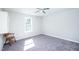 Bedroom with neutral carpet, ceiling fan and a window that provides natural light at 4324 Old Lewis Farm Rd, Raleigh, NC 27604