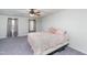 Spacious bedroom featuring large windows and curtains with a king bed at 4324 Old Lewis Farm Rd, Raleigh, NC 27604