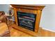 Living room fireplace with mantle and hardwood floors at 4324 Old Lewis Farm Rd, Raleigh, NC 27604
