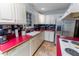 Kitchen with custom cabinets, stainless steel appliances and red counter tops at 4324 Old Lewis Farm Rd, Raleigh, NC 27604