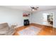 Living room featuring a fireplace and hardwood flooring at 4324 Old Lewis Farm Rd, Raleigh, NC 27604