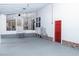 Enclosed patio with painted floors, red door and additional porch space at 4324 Old Lewis Farm Rd, Raleigh, NC 27604