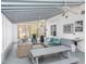 Spacious screened porch featuring seating, a dining area, and a sink perfect for entertaining at 4324 Old Lewis Farm Rd, Raleigh, NC 27604