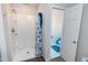 Step-in shower features tiled base and framed glass doors at 4324 Old Lewis Farm Rd, Raleigh, NC 27604