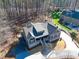 Aerial view of the home showing the gray siding, the front porch, and circular driveway at 4721 Cypress Ford Dr, Fuquay Varina, NC 27526