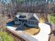 Aerial view of the home showing the gray siding, the front porch, the driveway and landscaping at 4721 Cypress Ford Dr, Fuquay Varina, NC 27526