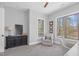 Comfortable bedroom featuring neutral colors, ample natural light, and a cozy seating area at 4721 Cypress Ford Dr, Fuquay Varina, NC 27526