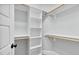 This large walk-in closet features built-in shelving and ample storage space at 4721 Cypress Ford Dr, Fuquay Varina, NC 27526