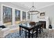 Dining room offers natural light, fireplace, traditional furnishings, and view of the yard at 4721 Cypress Ford Dr, Fuquay Varina, NC 27526