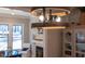 Chandelier and wood trim decorate this dining room that includes a fireplace and view of the yard at 4721 Cypress Ford Dr, Fuquay Varina, NC 27526