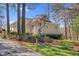 Well-maintained home with a charming front porch and a meticulously landscaped yard in a serene setting at 4721 Cypress Ford Dr, Fuquay Varina, NC 27526