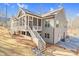 This home has an outdoor porch, staircase, backyard, and gray siding at 4721 Cypress Ford Dr, Fuquay Varina, NC 27526