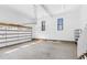 The garage features a roll-up garage door, three windows, and a concrete floor at 4721 Cypress Ford Dr, Fuquay Varina, NC 27526