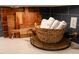 A basket filled with hand towels and wooden cutting boards rest on a counter in the kitchen at 4721 Cypress Ford Dr, Fuquay Varina, NC 27526