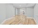 Spacious living room with light hardwood floors, fresh paint and neutral decor offers a modern, airy feel at 4721 Cypress Ford Dr, Fuquay Varina, NC 27526