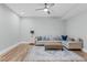 Cozy living room with hardwood floors, ceiling fan and neutral decor, perfect for relaxing at 4721 Cypress Ford Dr, Fuquay Varina, NC 27526