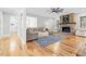 Bright living room with a stone fireplace, hardwood floors, and comfortable seating at 4721 Cypress Ford Dr, Fuquay Varina, NC 27526