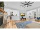 Spacious living room with stone fireplace, hardwood floors, and open to the gourmet kitchen at 4721 Cypress Ford Dr, Fuquay Varina, NC 27526