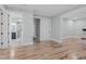 Bright living room with hardwood floors and fresh light blue walls provides a cozy, airy atmosphere at 4721 Cypress Ford Dr, Fuquay Varina, NC 27526
