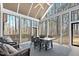Screened porch with patio furniture and forest views at 4721 Cypress Ford Dr, Fuquay Varina, NC 27526