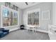 Charming playroom with 'PLAY' decor, large windows, and kid-friendly furnishings at 4721 Cypress Ford Dr, Fuquay Varina, NC 27526