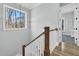 Bright staircase featuring wood railing, white risers and natural light at 4721 Cypress Ford Dr, Fuquay Varina, NC 27526