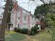 Exterior view of a brick house showcasing a porch and backyard at 501 North St, Chapel Hill, NC 27514