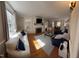 Bright and inviting living room with hardwood floors, a fireplace, large windows, and comfortable seating, perfect for relaxation at 501 North St, Chapel Hill, NC 27514