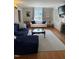 Cozy living room featuring hardwood floors, natural light, and a fireplace at 501 North St, Chapel Hill, NC 27514