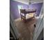 Cozy bedroom with a bunk bed, hardwood floors, and a ceiling fan, providing a comfortable retreat at 512 Monroe Holt Rd, Graham, NC 27253