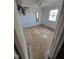 Bright bedroom featuring a window, hardwood floors, and neutral walls, offering a blank canvas for personalization at 512 Monroe Holt Rd, Graham, NC 27253