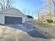 Inviting front exterior featuring an attached garage and a well-maintained walkway leading to the entrance at 512 Monroe Holt Rd, Graham, NC 27253