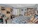 Cozy bedroom features a bed, bookshelves, and cabinet, ideal for relaxation or a productive work space at 515 Swim & Croquet, Pittsboro, NC 27312