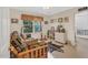 Bright bedroom featuring a cozy couch and large windows that fills the space with natural light at 515 Swim & Croquet, Pittsboro, NC 27312