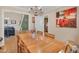 Inviting dining room with wood table and chandelier adjacent to the living room at 515 Swim & Croquet, Pittsboro, NC 27312